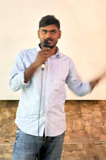 Virendra Singh telling a story at Open Mic Event
